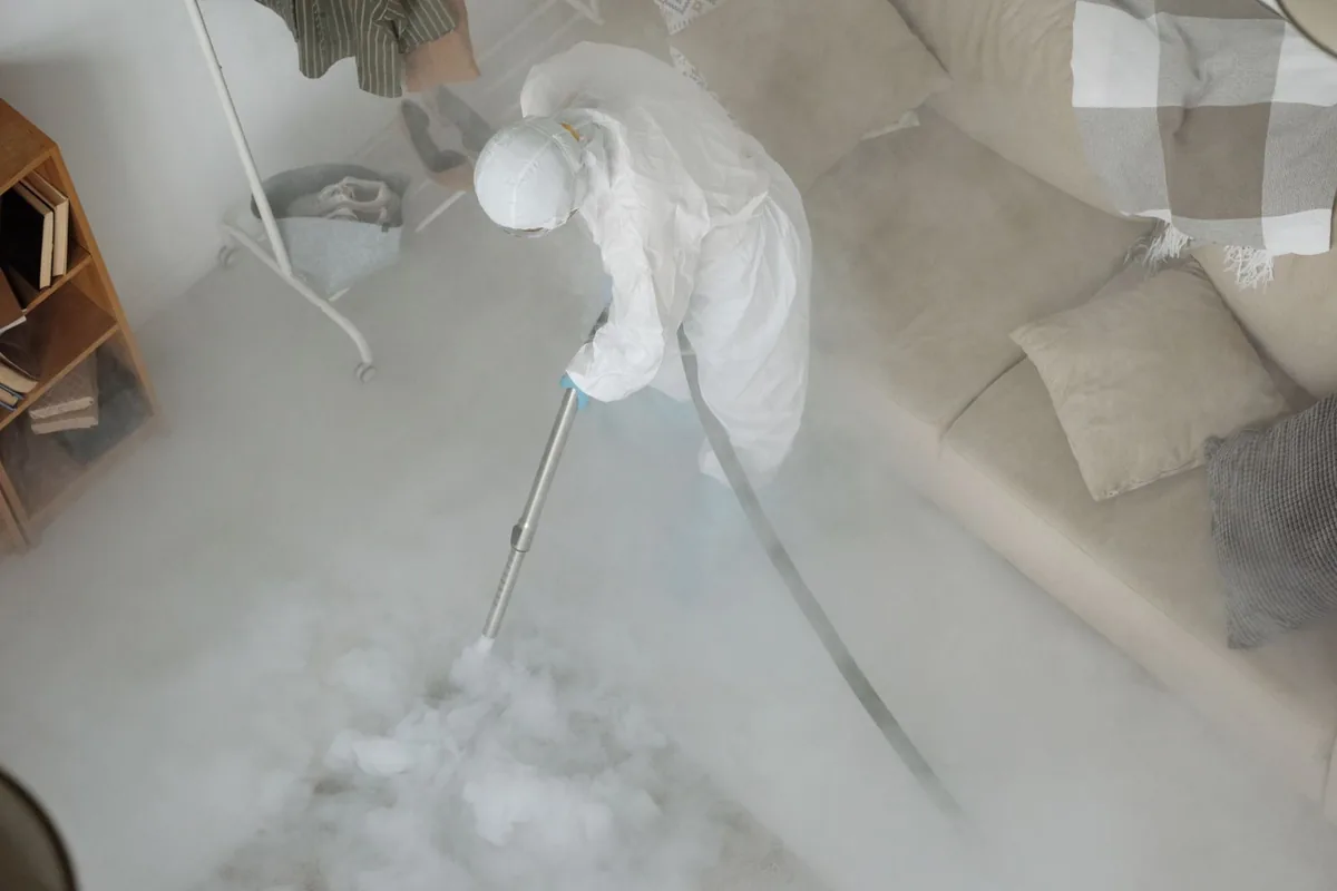 Biohazard cleanup technician in protective equipment, Crystal Falls, MI